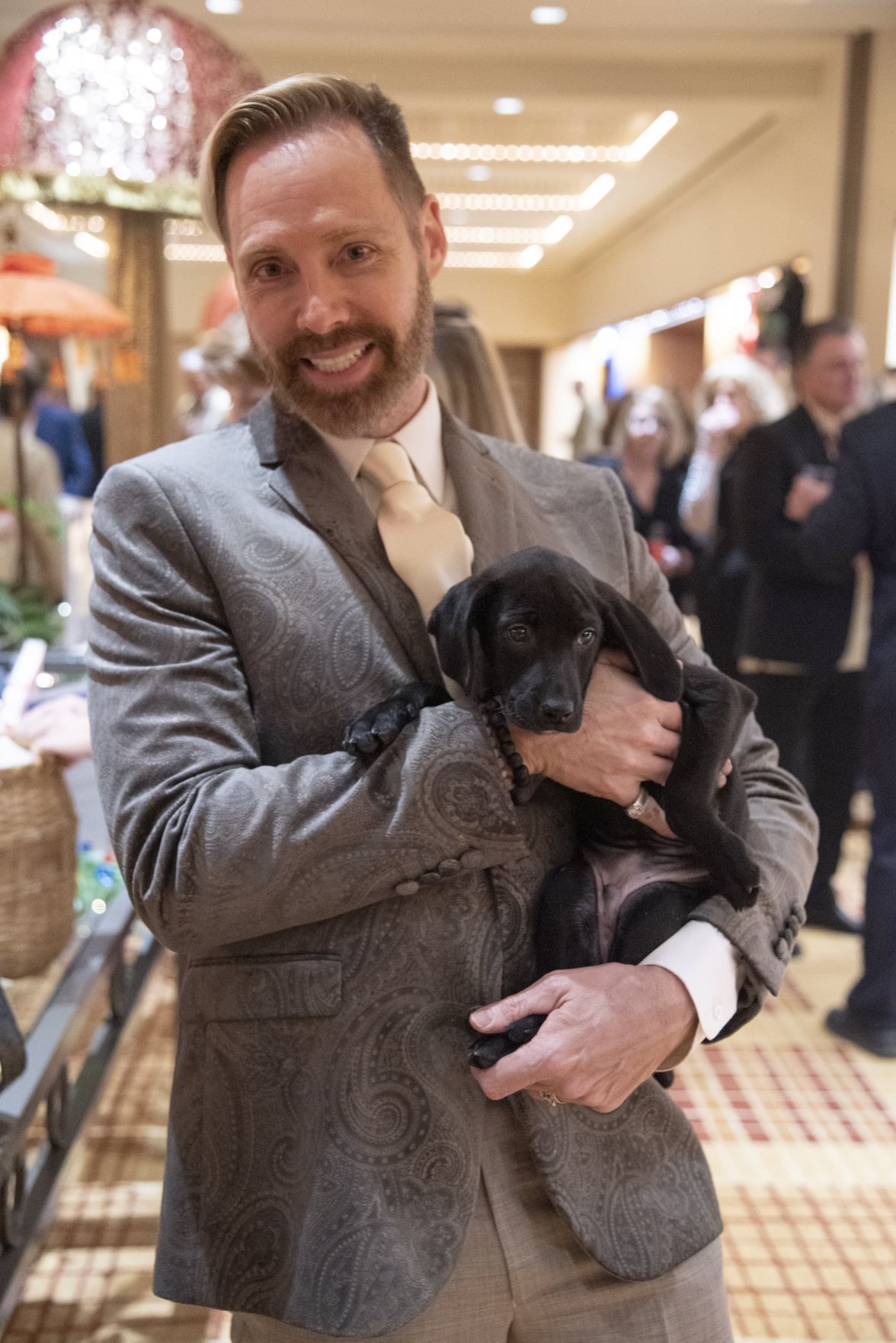 James L Mitchell and Brad the auction puppy